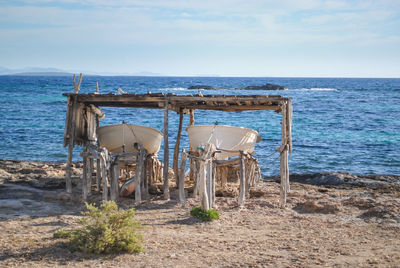 Boats in a shelter on formentera's coast overlooking the bay.