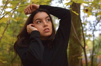 Portrait of young woman looking away