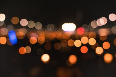 Defocused image of illuminated lights at night