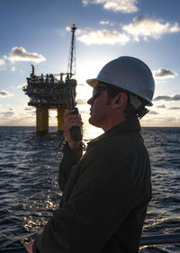 Offshore energy production with person on ship