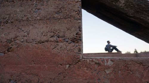 Man on wall in city