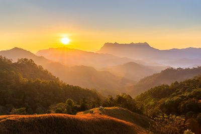 Scenic view of mountains against sky during sunset