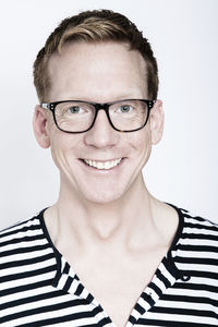 Portrait of young man against white background