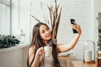 Young woman using smart phone