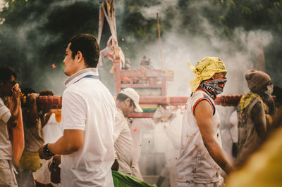 Group of people on smoky street