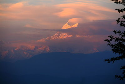 Low angle view of silhouette mountains against sky at sunset