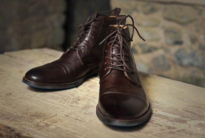 Close-up of shoes on table