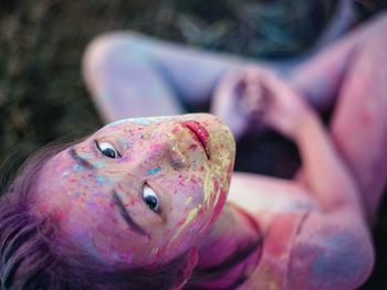 Portrait of young woman with powder paint