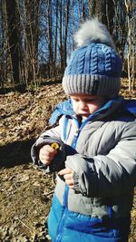 Rear view of boys on field during winter