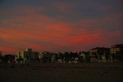 Scenic view of beach against sky during sunset