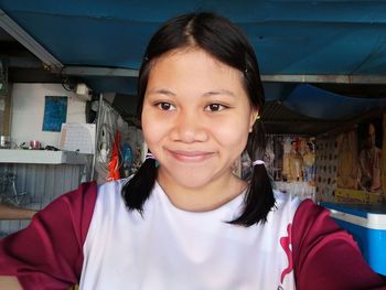 Close-up of smiling woman looking away