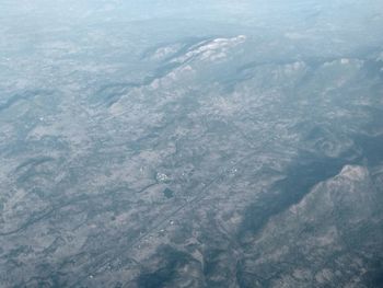 High angle view of sea and land