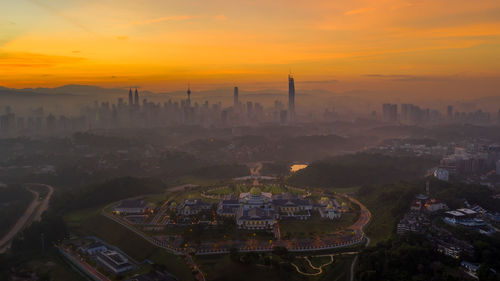 High angle view of townscape against sky during sunset