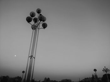 Low angle view of street light against clear sky during sunset