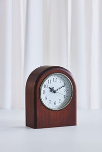 Close-up of clock on table