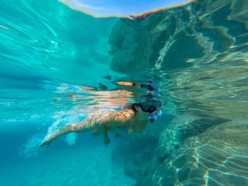 Woman swimming in sea