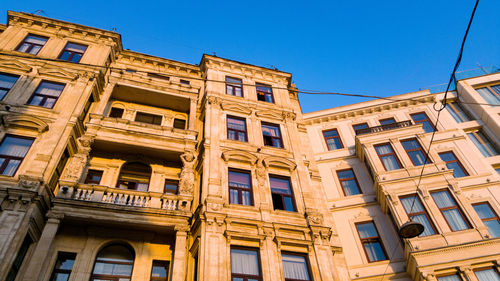 Low angle view of historical building against blue sky