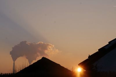 Low angle view of silhouette mountain against sky during sunset