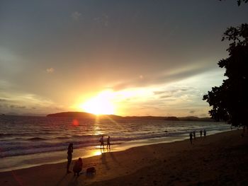 Scenic view of beach against sky during sunset