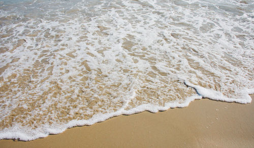 High angle view of surf on beach