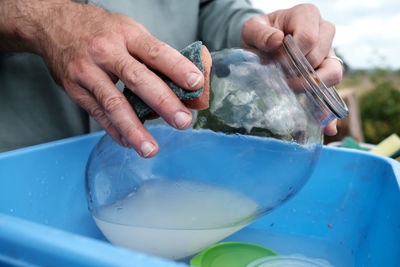 Close-up of man preparing food