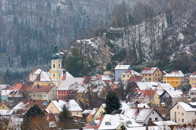High angle view of townscape and trees during winter