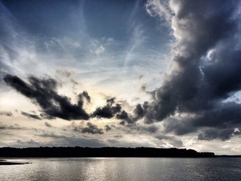 Scenic view of lake against sky during sunset