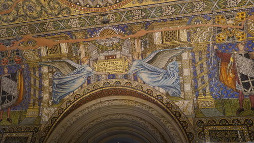 Low angle view of ornate ceiling in temple building