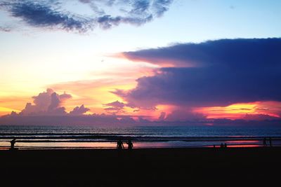 Scenic view of beach against sky during sunset