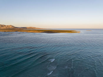 Scenic view of sea against clear sky