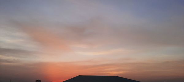 Low angle view of dramatic sky during sunset