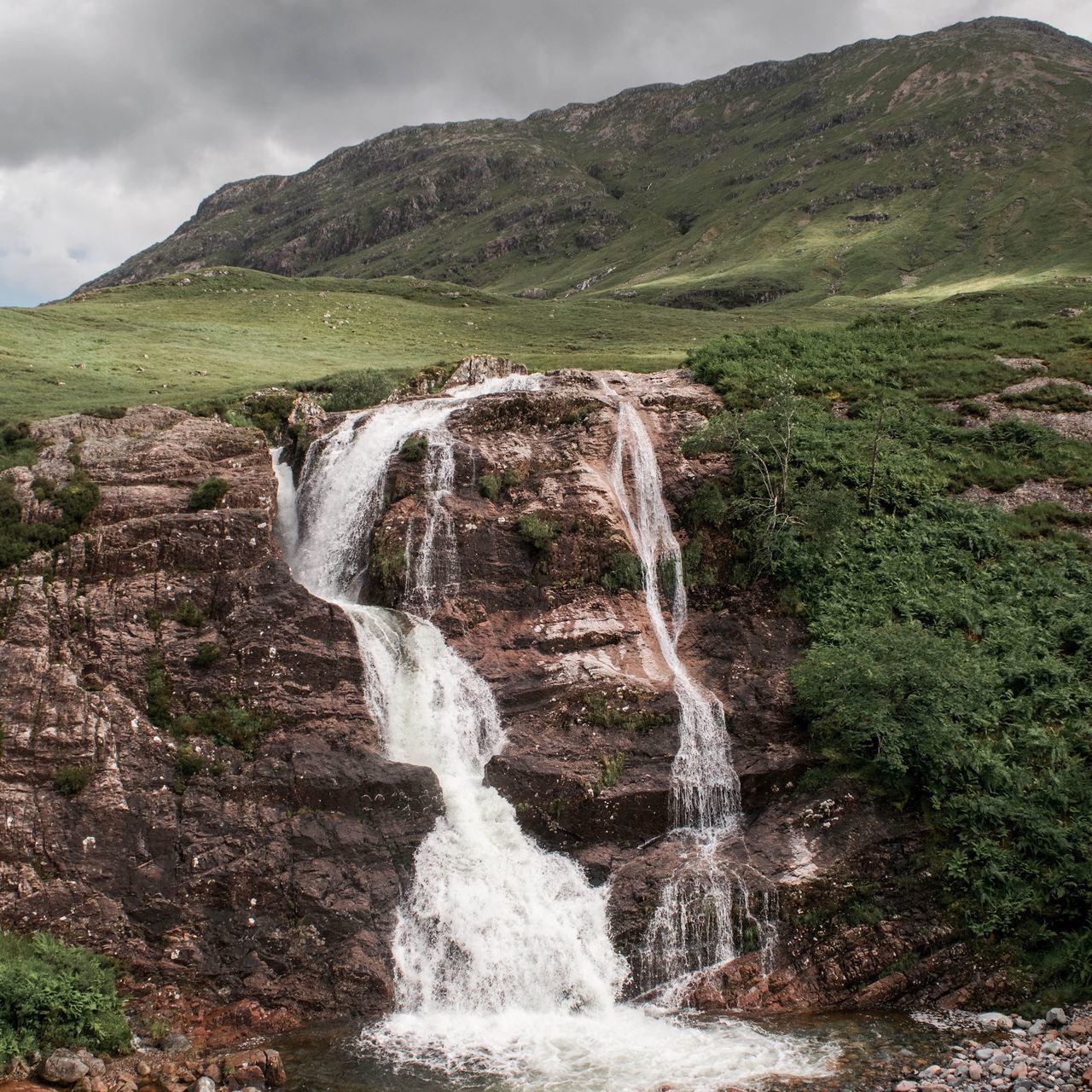 waterfall, water, motion, flowing water, scenics, long exposure, beauty in nature, flowing, rock - object, nature, power in nature, rock formation, blurred motion, mountain, idyllic, splashing, environment, tranquil scene, sky, cliff