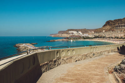 Scenic view of sea against clear blue sky