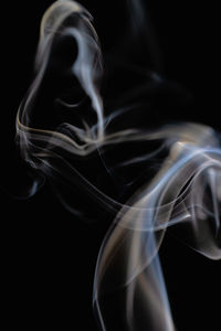 Close-up of smoke against black background