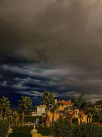 Storm clouds over city at night