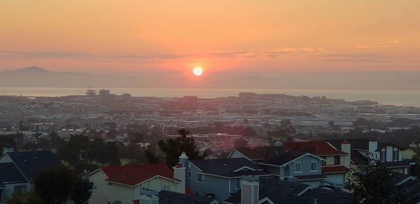High angle view of townscape against sky during sunset