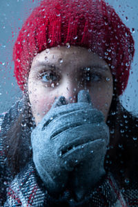 Close-up portrait of a woman in snow