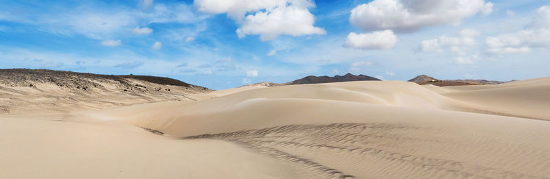 Panoramic view of desert against sky