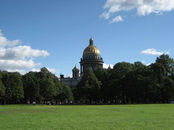 Trees and building against sky