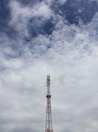Low angle view of communications tower against sky