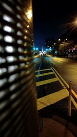 Illuminated street light at night