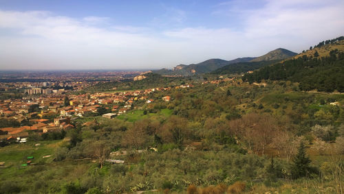 Scenic view of landscape against cloudy sky