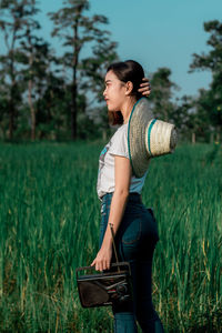 Woman standing on field