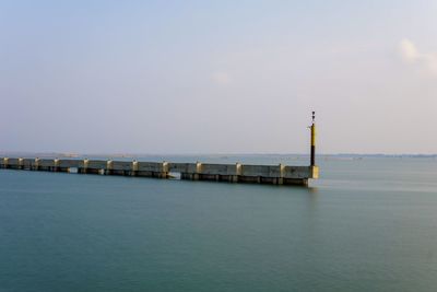 Pier over sea against sky