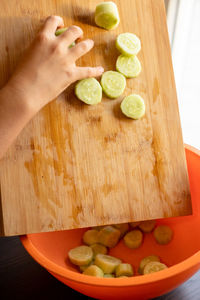 Cropped hand of person preparing food