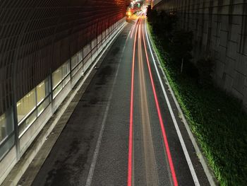 High angle view of light trails on road at night