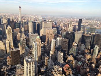 High angle view of modern buildings in city against sky