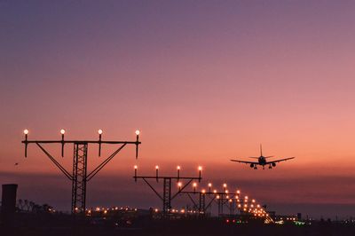 Airplane flying in sky at night