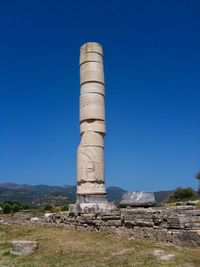 Built structure on land against clear blue sky