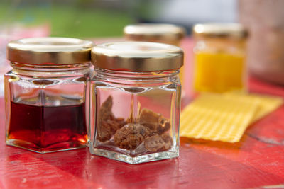 Close-up of beer in glass jar on table